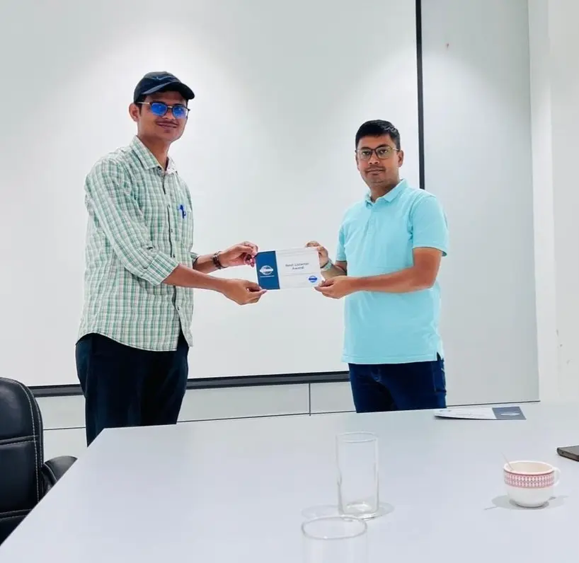 Toastmasters member receiving award, public speaking achievement.