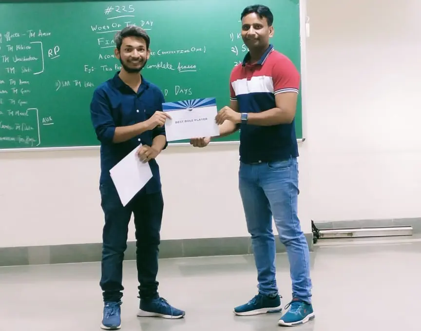 Toastmasters member receiving award, public speaking achievement.