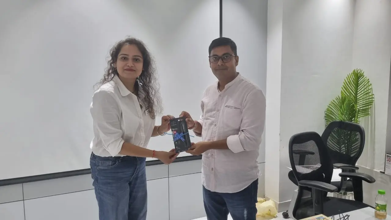 Toastmasters member receiving award, public speaking achievement.