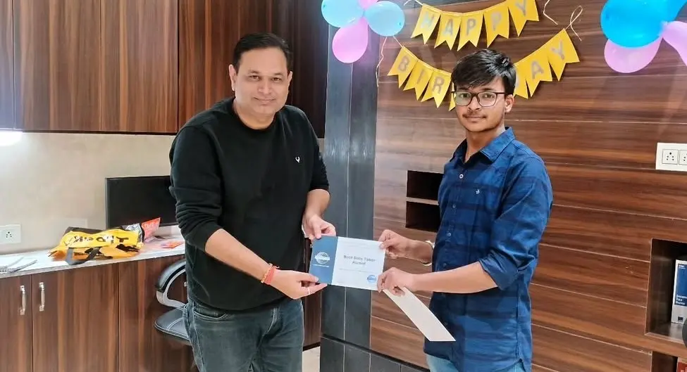 Toastmasters member receiving award, public speaking achievement.