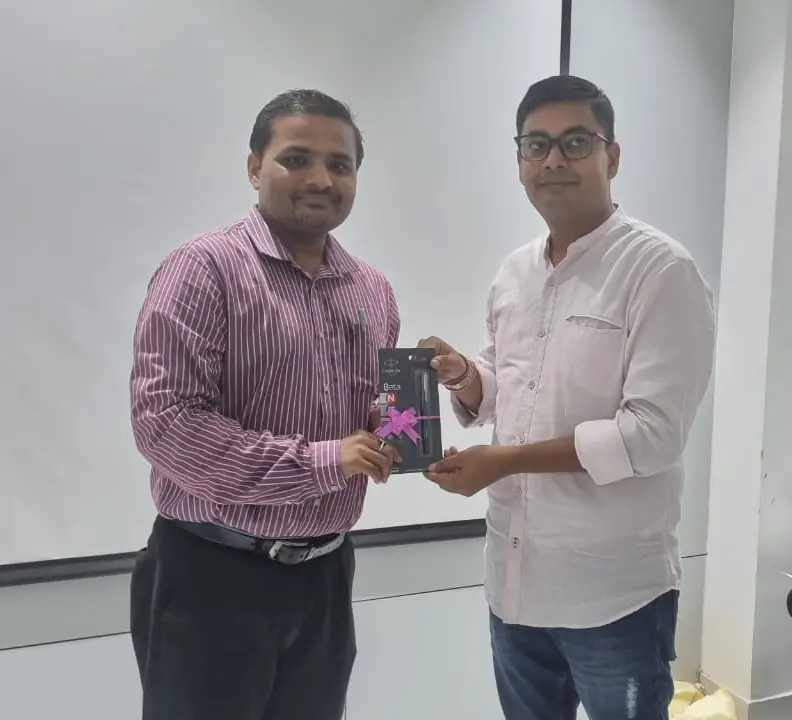 Toastmasters member receiving award, public speaking achievement.