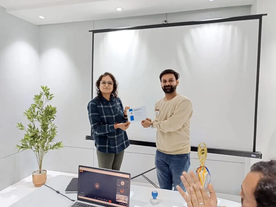 Toastmasters member receiving award, public speaking achievement.